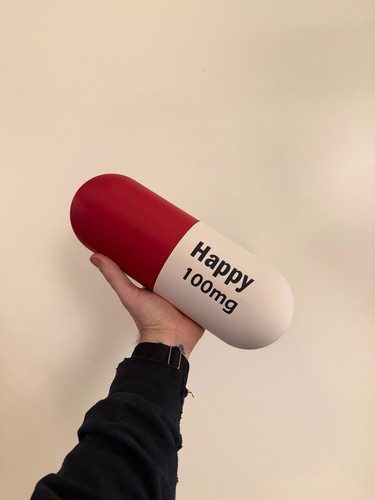 Giant happy 100mg pill - pill, wall